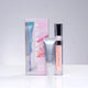 Liquid Glow eye and lip duo packaging with Opti Crystal eye serum and Lumi Crystal lip hydrator beside a pastel box