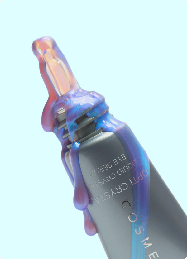 Cosmetic product with iridescent cap on a light blue background